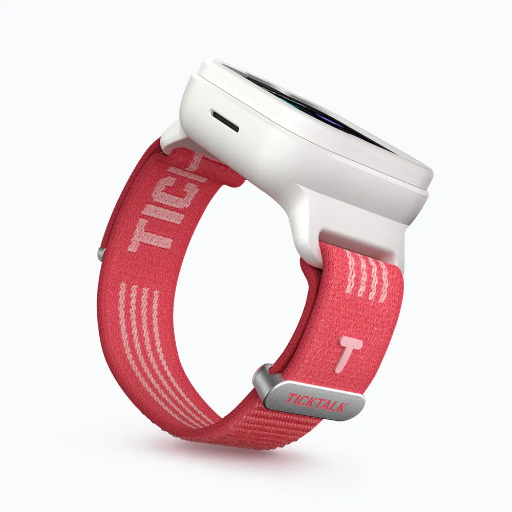 Coral Pink TickTalk 6 replacement wristband on a white smartwatch, side view.