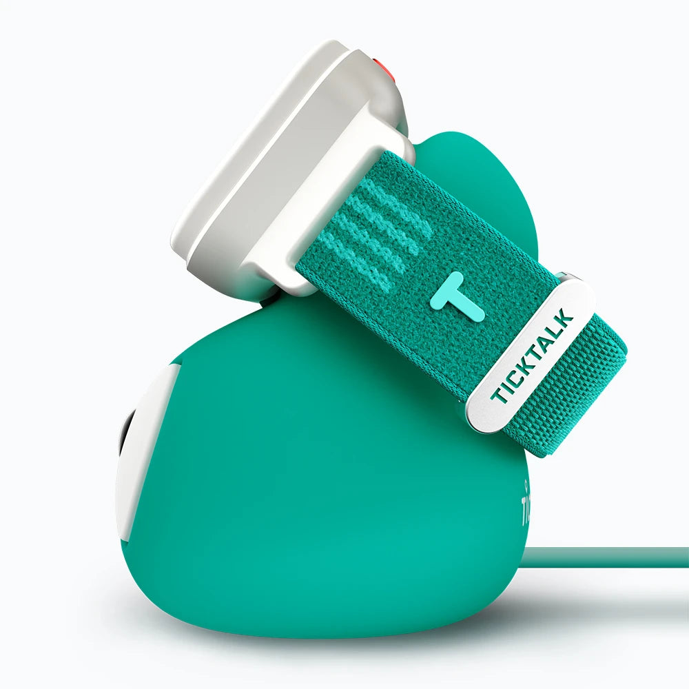 TickTalk 6 kids smartwatch on its green charging dock, left-side view.
