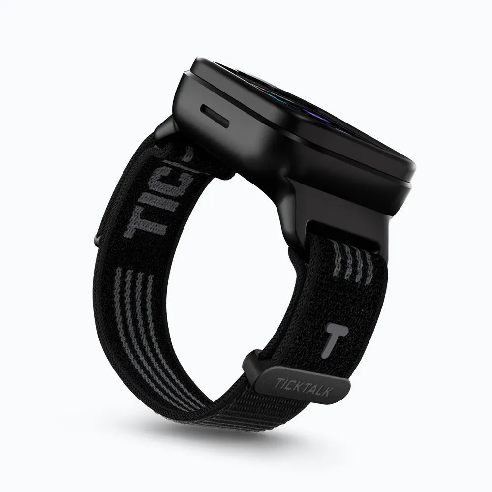 Black Sand TickTalk 6 replacement wristband on a black smartwatch, side view. 