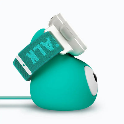 TickTalk 6 teal Power Base charging stand holding a Lunar White kids smartwatch with a teal band, side view.