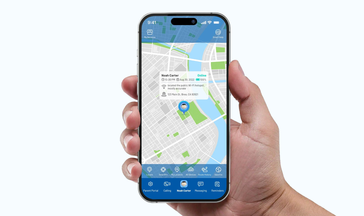 Hand holding a phone with a child's location displayed on the TickTalk parent app map