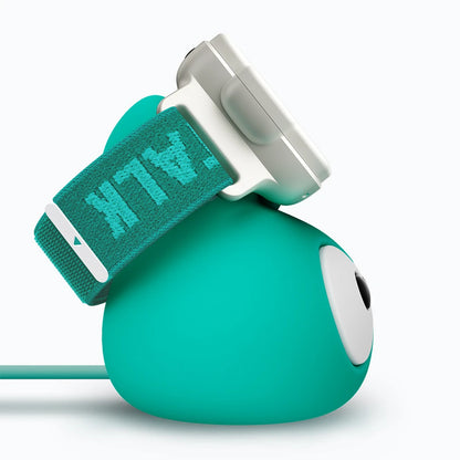 TickTalk 6 kids smartwatch on its green charging dock, right-side view.